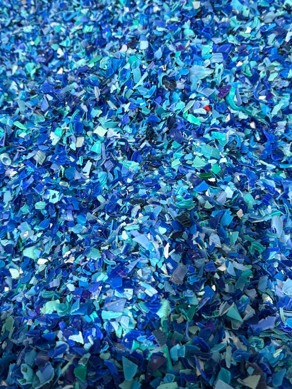 Blue plastic flakes during material sorting