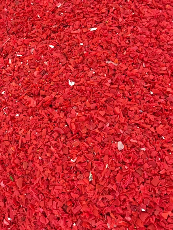 Red plastic flakes during material sorting